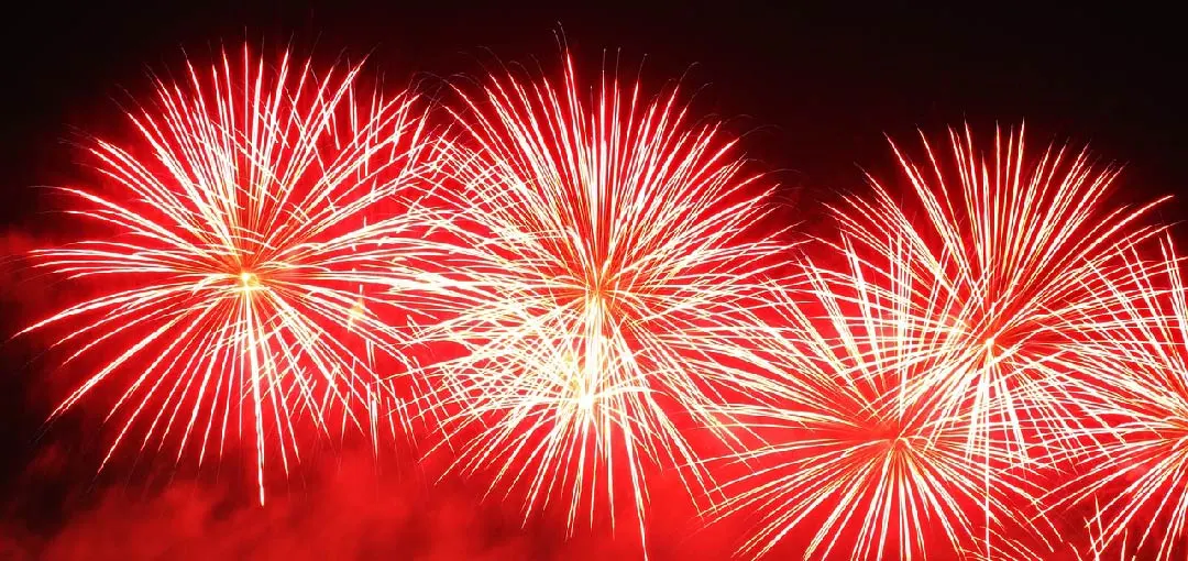 Fireworks bursting in the night sky, predominantly featuring bright red and white colours, creating a festive atmosphere. The image symbolizes the launch of a new DNS monitoring platform designed to protect your DNS effectively.